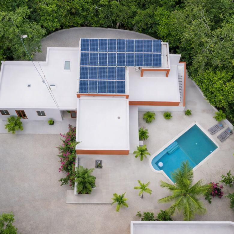 Hacienda Richardson for sale in Los Árboles Tulum, listed by Play-Investments.com. Sustainable mid-century home on 5 acres with solar system, guest house and potable water. USD 420,000.
