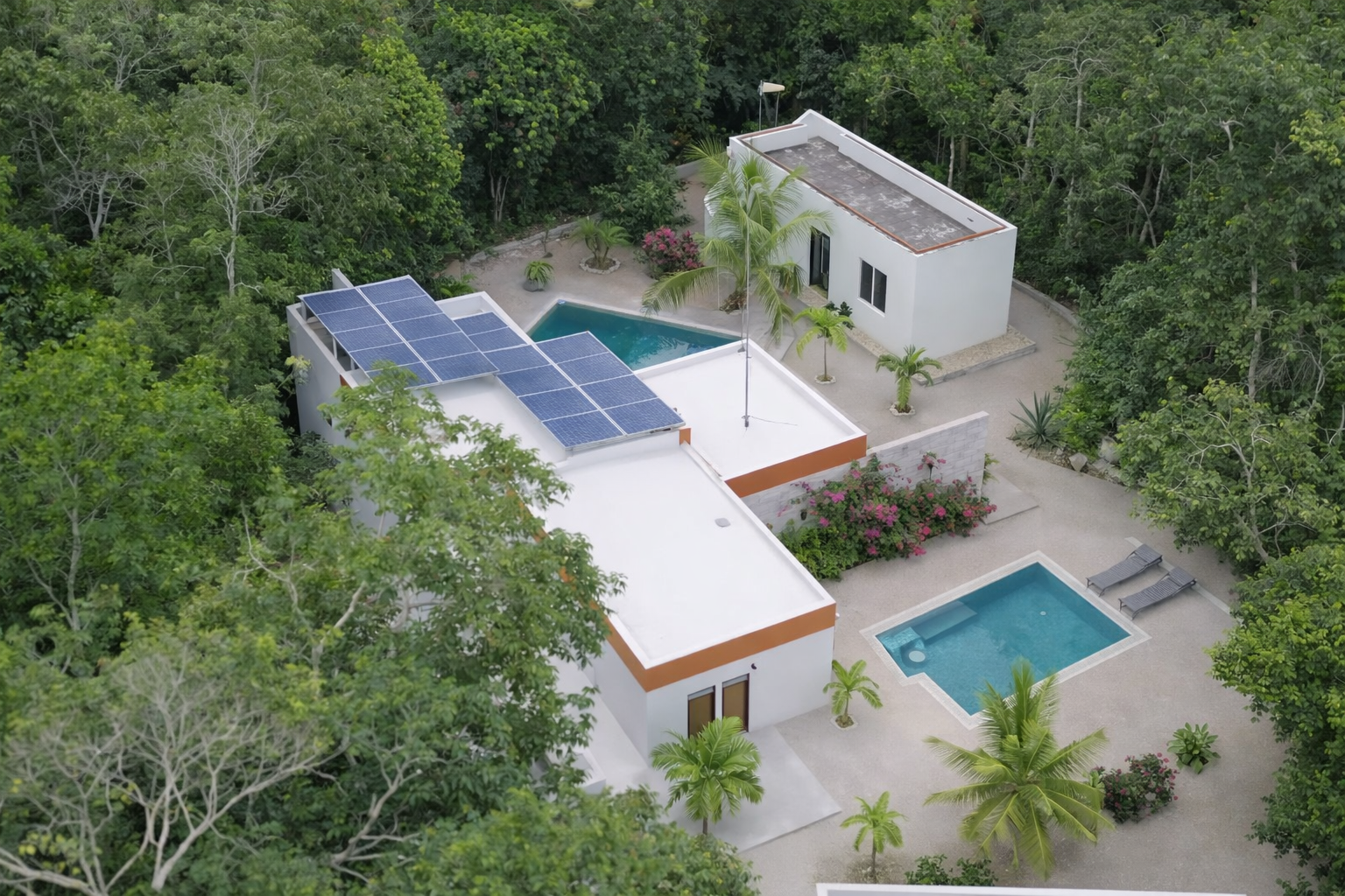 Hacienda Richardson for sale in Los Árboles Tulum, listed by Play-Investments.com. Sustainable mid-century home on 5 acres with solar system, guest house and potable water. USD 420,000.